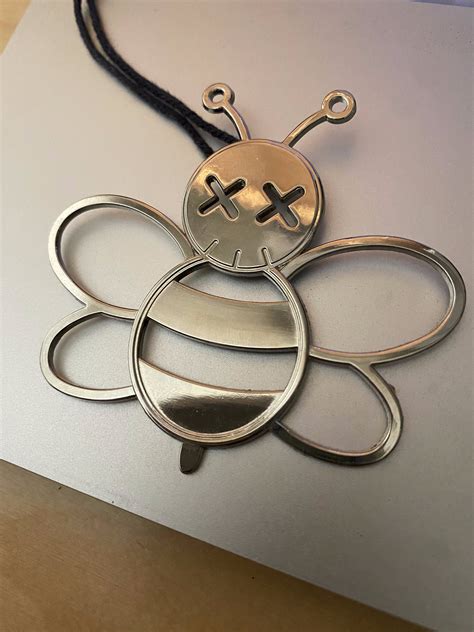 dior kaws bee charm|DIOR x KAWS Bee Bag Charm – Collections Couture.